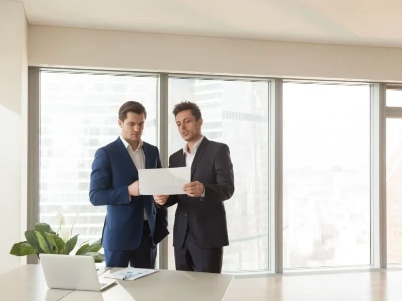 (800x600)Two serious businessmen discussing building plan