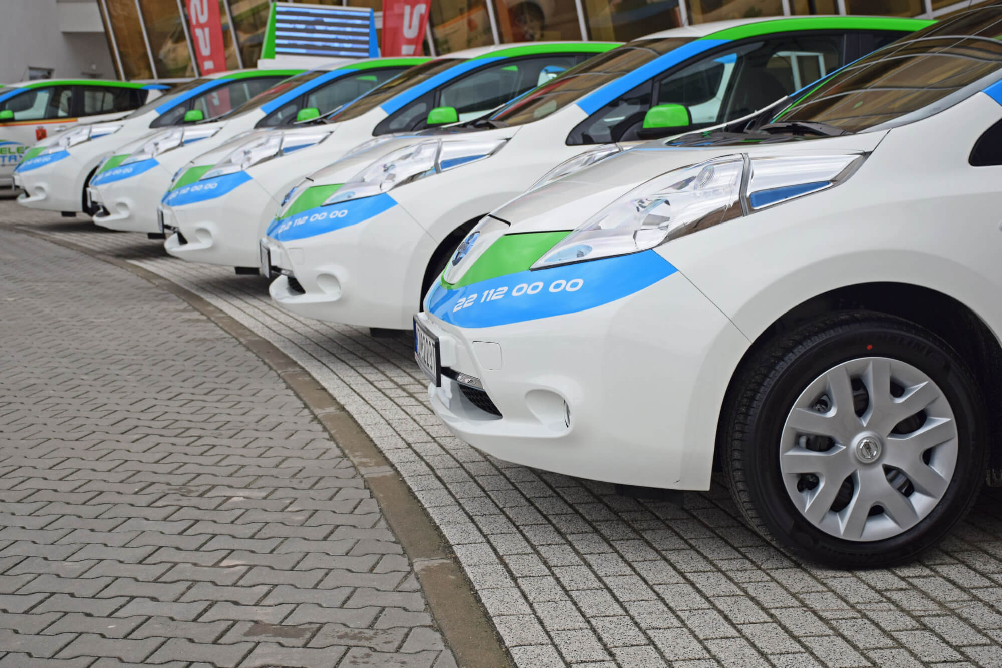 (Resized)Electric taxi cars parking in a row