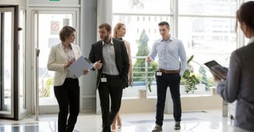 Employees in busy office lobby