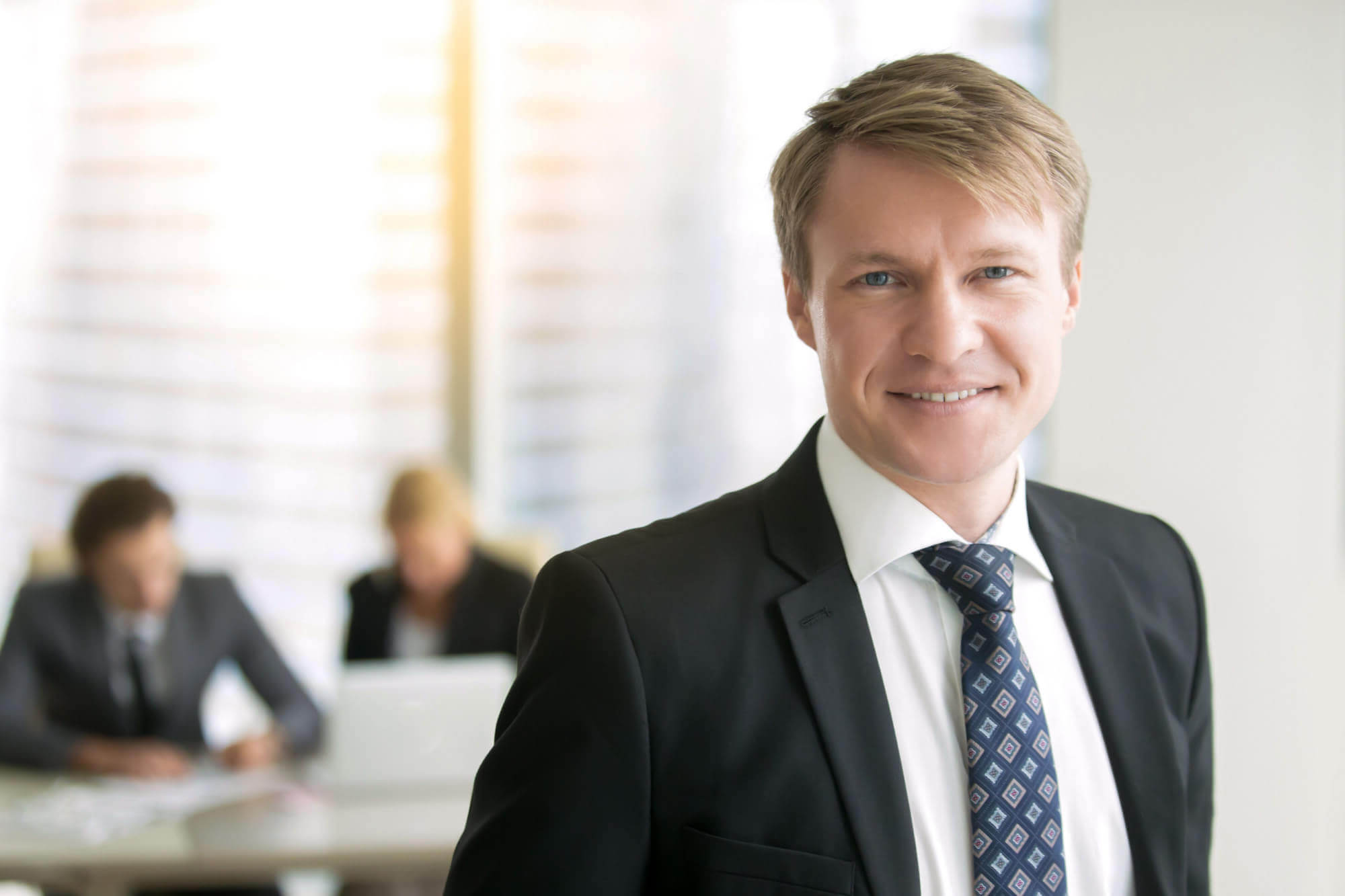 Portrait of young smiling businessman