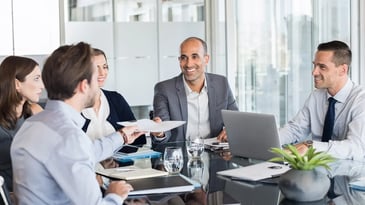 Group of business people working at a table
